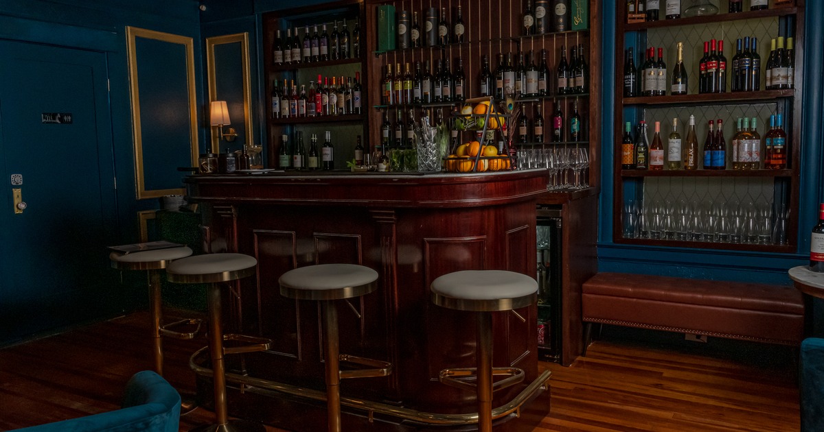 Interior, bar, chairs, drink rack behind