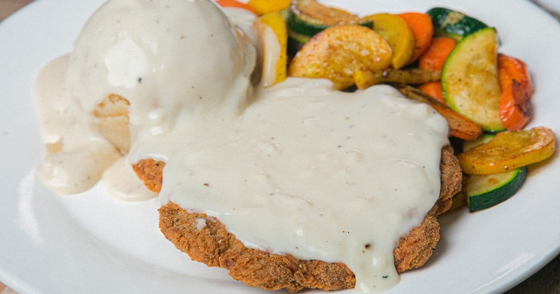 Country Fried Steak, with biscuits and gravy, and veggies