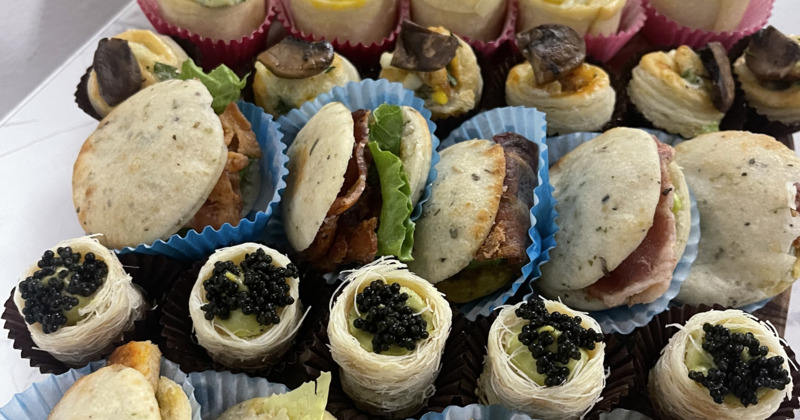 Mini sandwiches and caviar pastry bites
