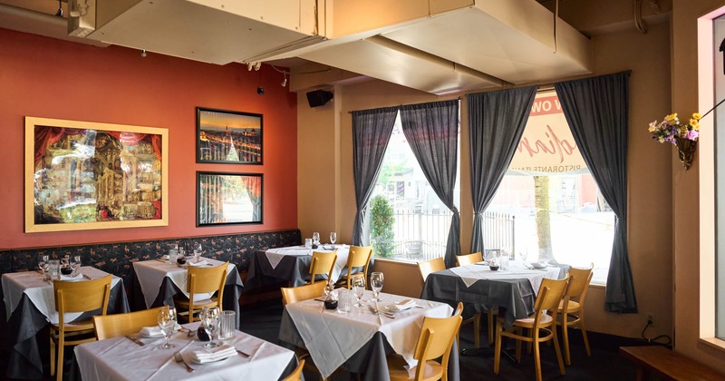 Interior, set tables waiting to receive guests