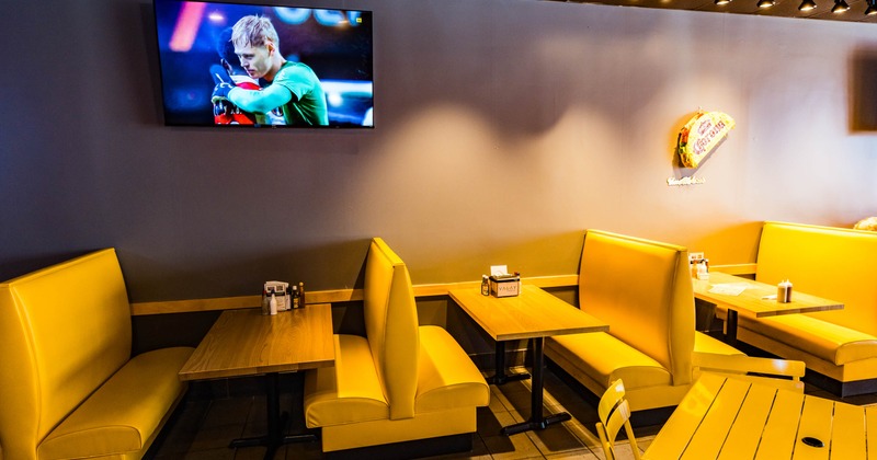 Interior, booths with TV on the wall