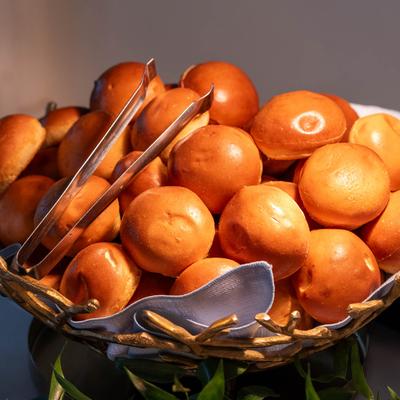 A  basket filled with fresh bread rolls.