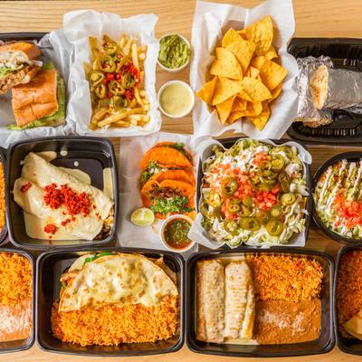 Assorted food in plastic food containers, top view.