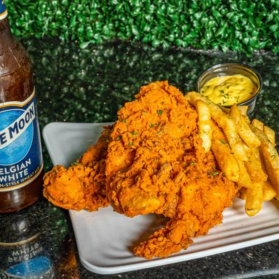 Chicken tenders with fries and beer.