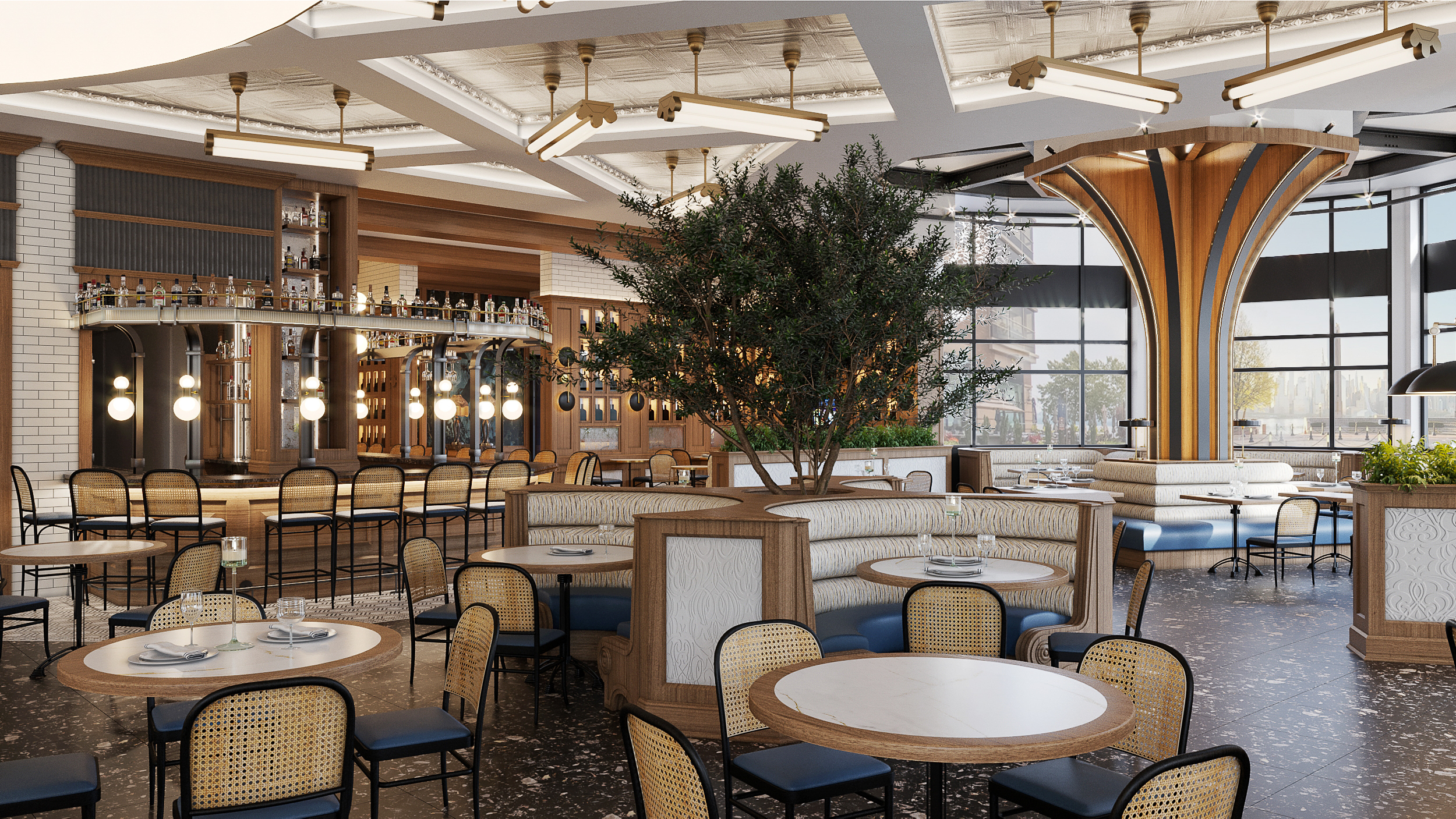 Dining area with curved booths, large indoor olive tree and view of the bar