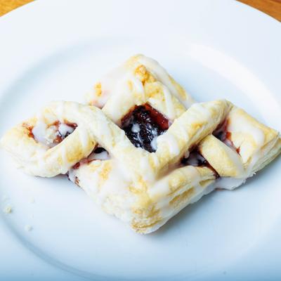 Raspberry Twist pastry topped with a sweet glaze.