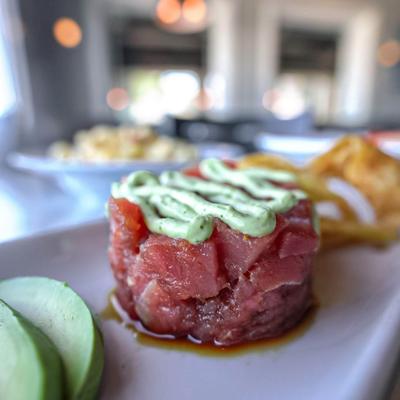 Tuna tartare topped with avocado-wasabi sauce.