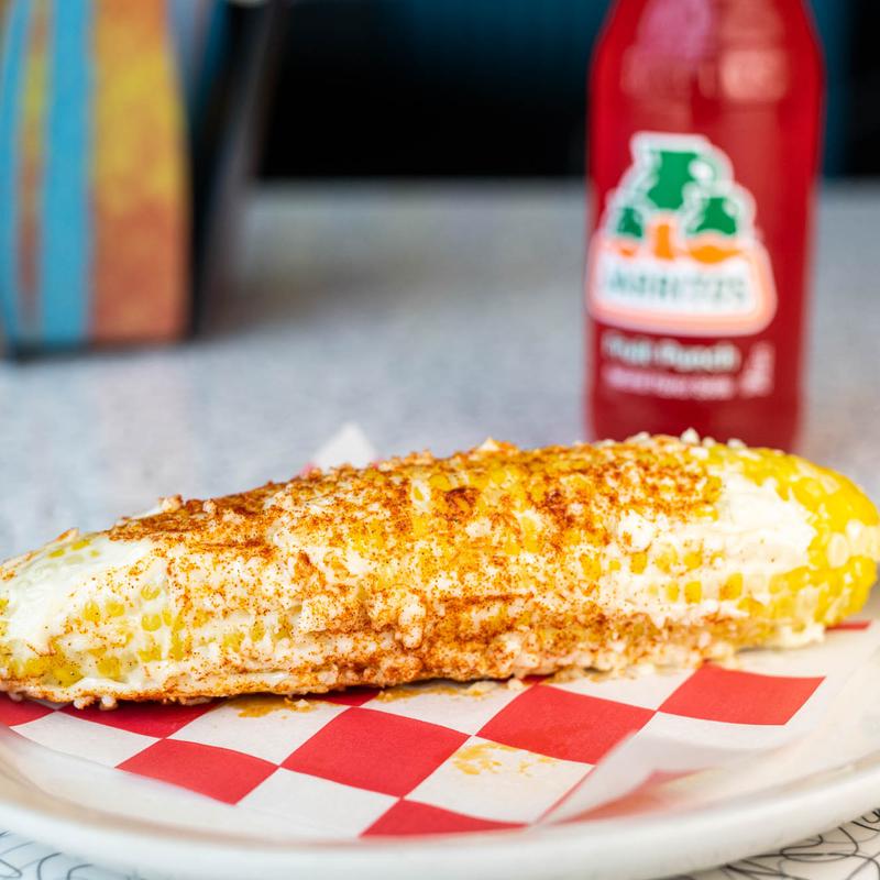 elotes en palo