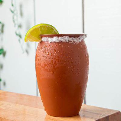 Cocktail in a clay cup.