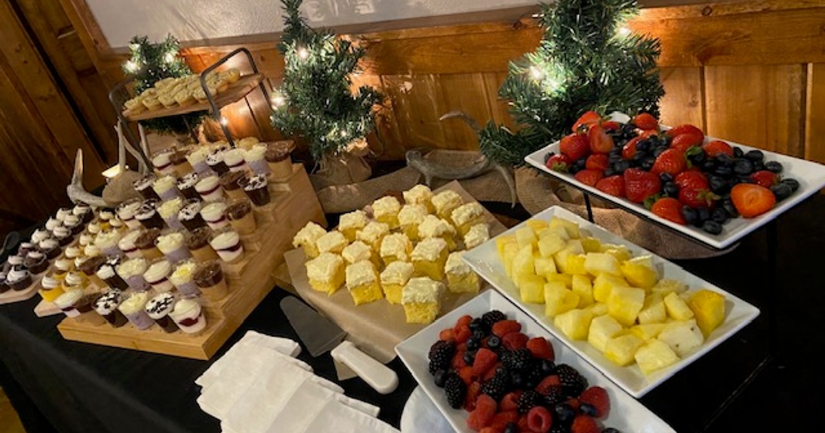 Dessert table with cakes and fresh fruit