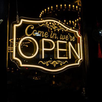 Neon open sign at the restaurant entrance.