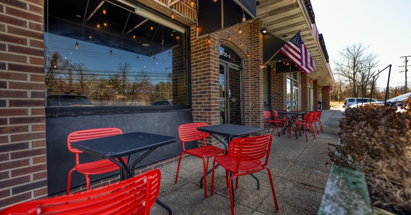 Outdoor seating area in front of the restaurant entrance