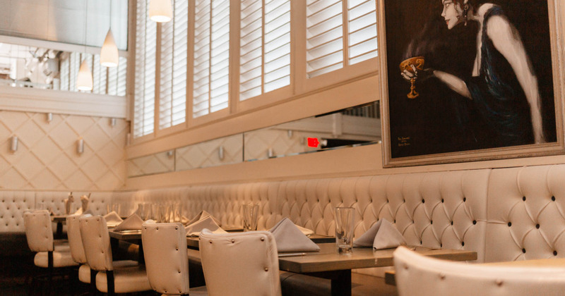 Downstairs interior, dining tables, leather bench seats and chairs