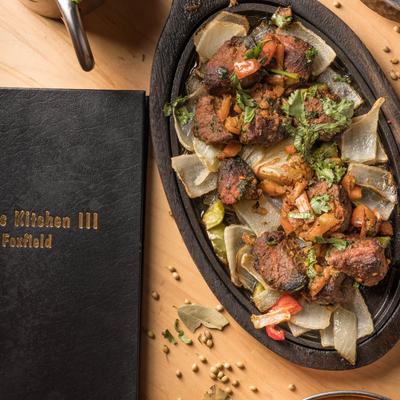 Marinated and barbecued lamb cubes, with sauteed veggies.