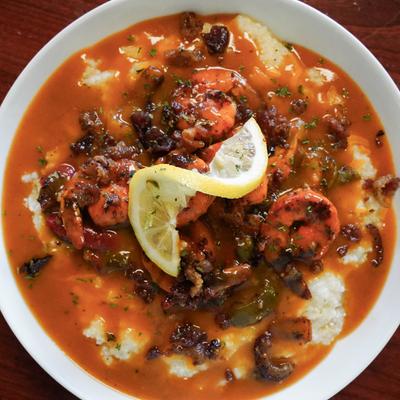 Shrimp and grits in tomato sauce.