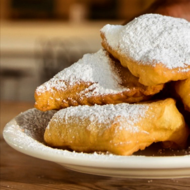 Beignets with powdered sugar, close up