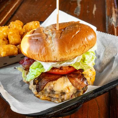 Bacon Smash Burger  served with a side of tater tots.