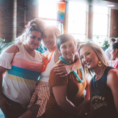 Four guests smiling, photo portrait