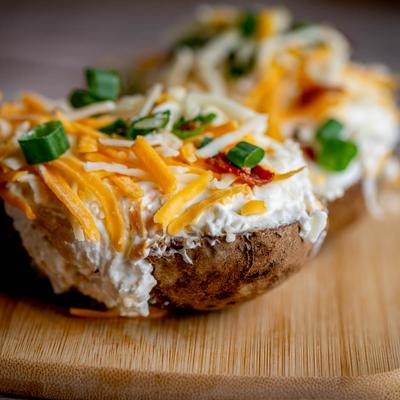 Twice baked potatoes with cream and cheese.