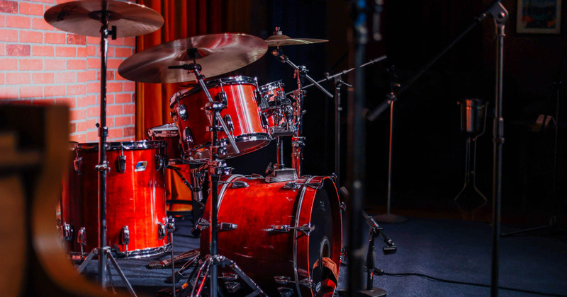 Inside, drum set on a stage