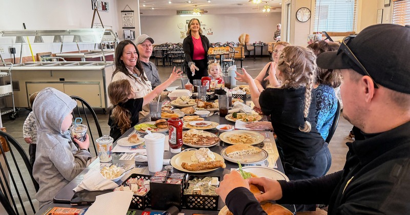 Family diner, table, fool of food and drinks, guests