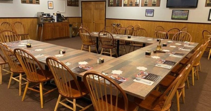 A spacious dining room filled with numerous tables and chairs