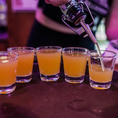 Bartender pouring shots.
