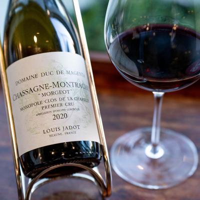 A bottle and glass of red wine.