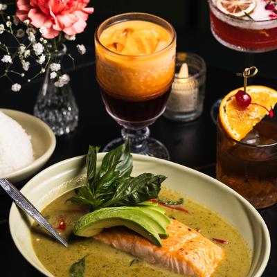 Salmon with avocado and basil in a creamy green curry sauce.