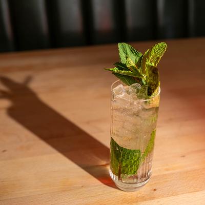 A glass of Mojito on a table.