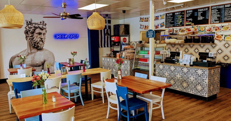 Interior, seating area with colorful chairs, order counter