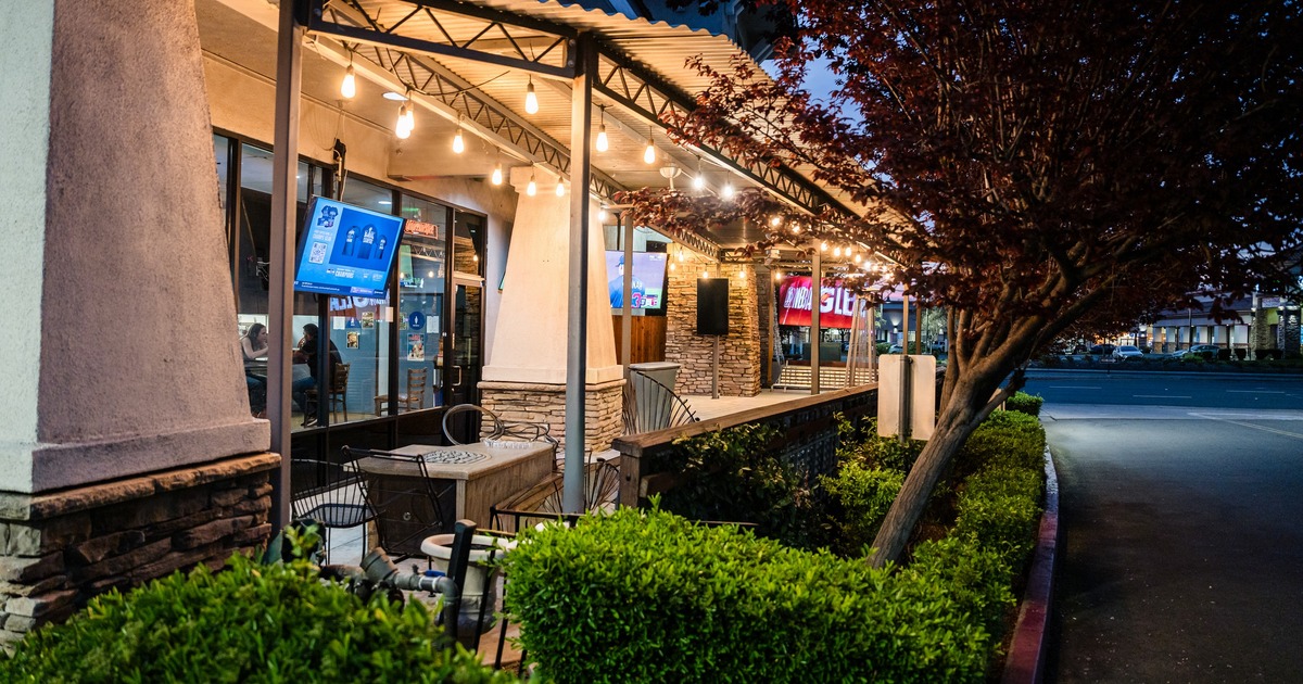 Exterior, patio with tables and chairs