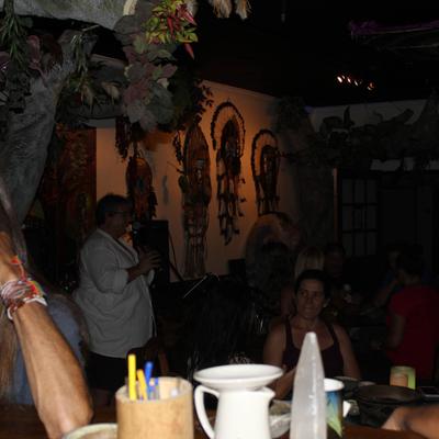 A fully served table during an evening event.