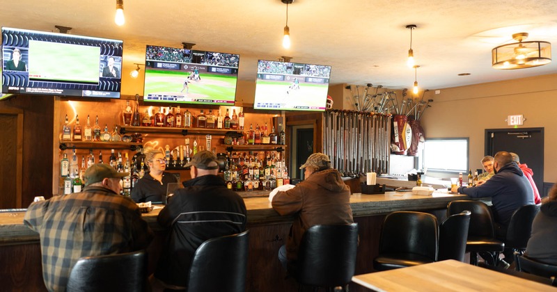 Interior, bar, tv's above, guests seating