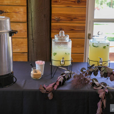 Two bottles of limunade and a coffee mashine