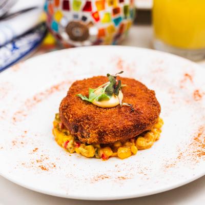 Maryland crab cake served over corn salad.