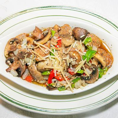 Sausages, with sauteed vegetables, and mushrooms.