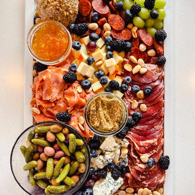 Charcuterie and cheese, with mixed fruits, vegetables and nuts