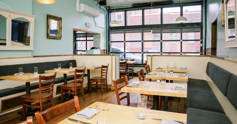 Interior, dining area with large windows in the back