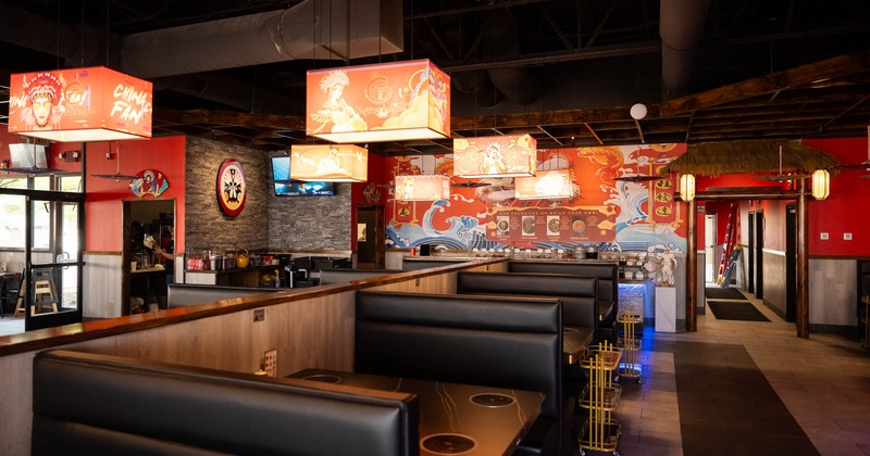 Interior seating space with tables and double booths, traditional Chinese decoration