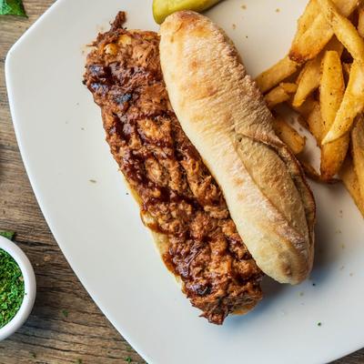 Pulled Pork Sandwich with fries and pickle