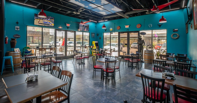 Interior, dining area, restaurant entrance, tables with chairs, tile flooring, ceiling fans