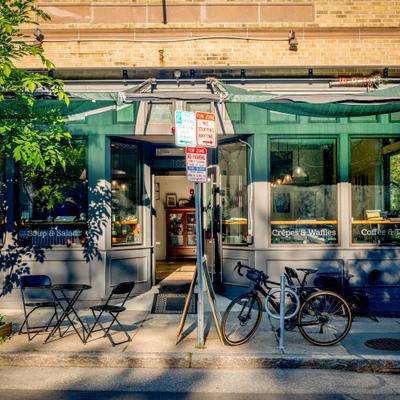 Cafe exterior with outdoor seating.