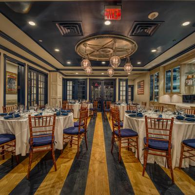 A large dining hall, tables and chairs.