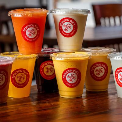 Stacked sealed cups with beverages.