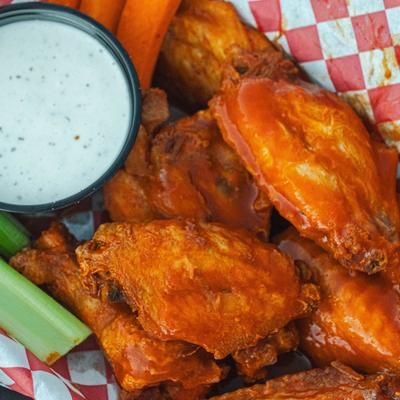 Buffalo chicken wings, with celery, carrots, and blue cheese dressing.