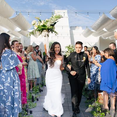 Two person's walking down the isle.