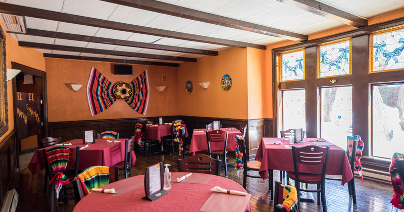 Interior, tables for four ready for guests