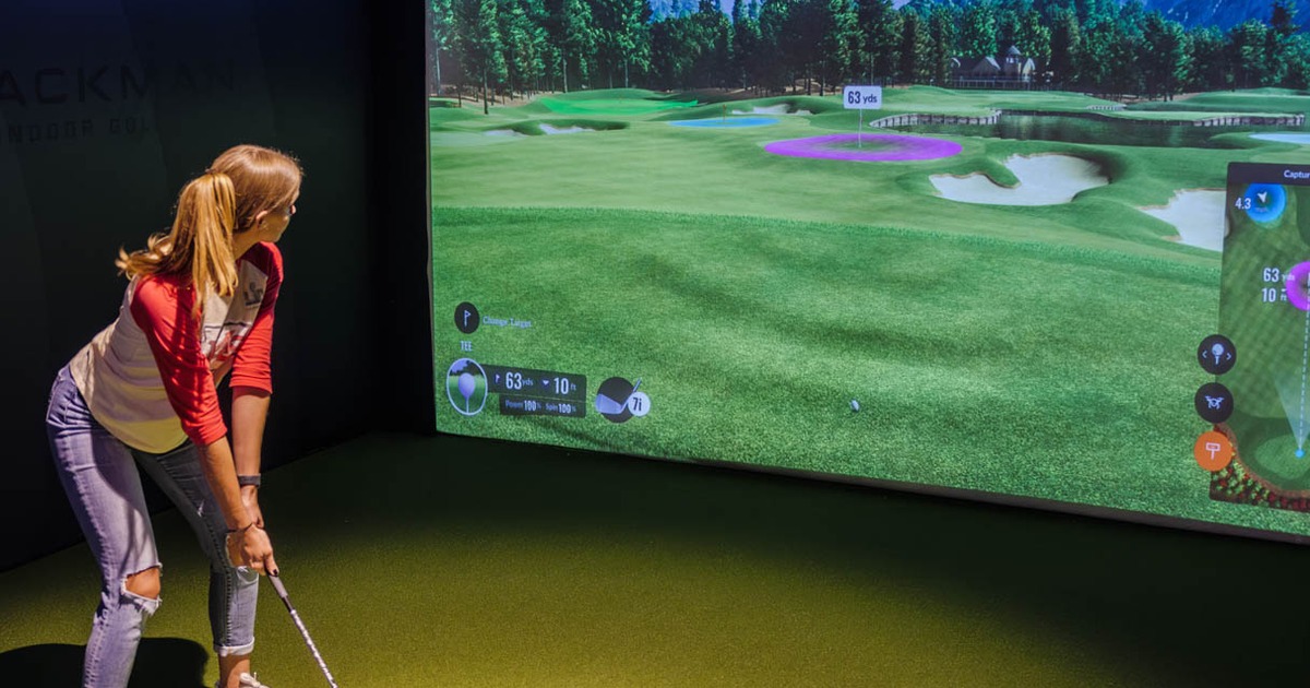 Customer playing virtual golf