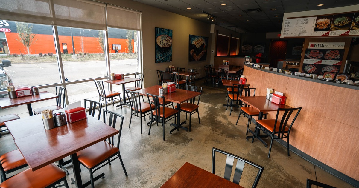 Interior, tables and chairs near bar